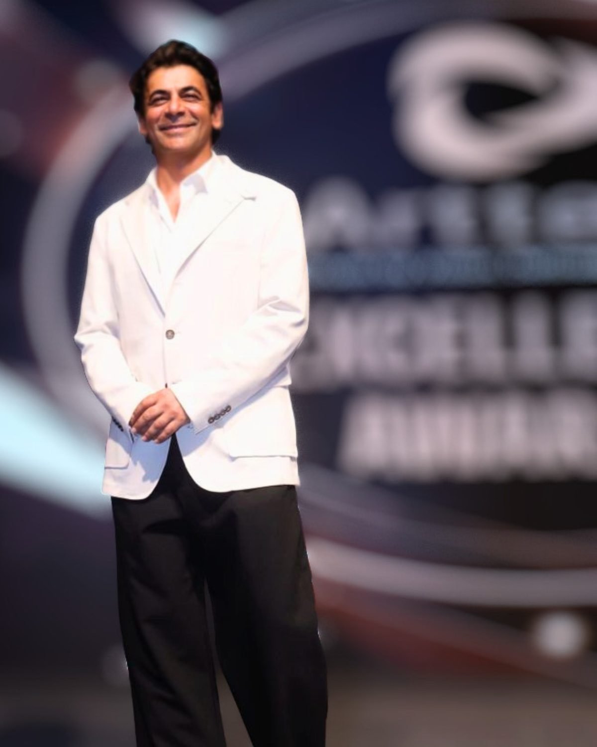 Celebrity anchor on stage at a corporate annual day in India Celebrity anchor on stage at a corporate annual day in India