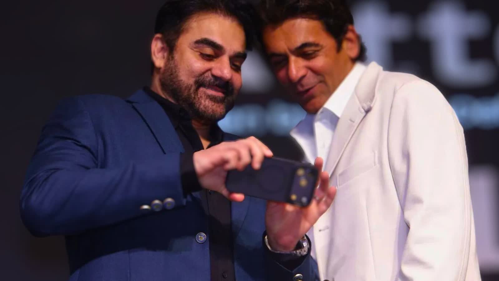 Celebrity hosts on stage at a corporate award night managed by TKC Talent